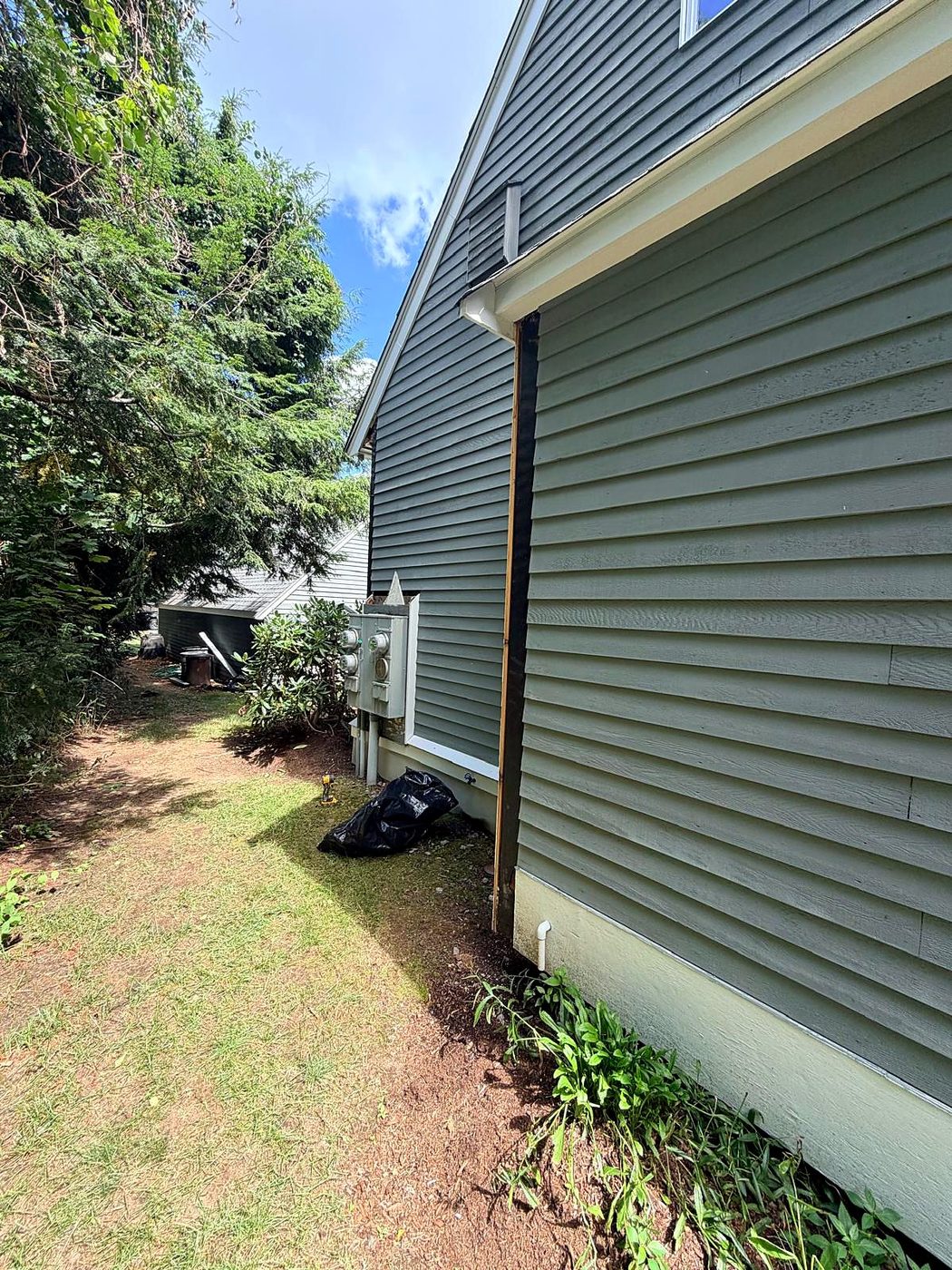 Building corner stripped to the membrane during trim replacement at a Concord, MA condominium